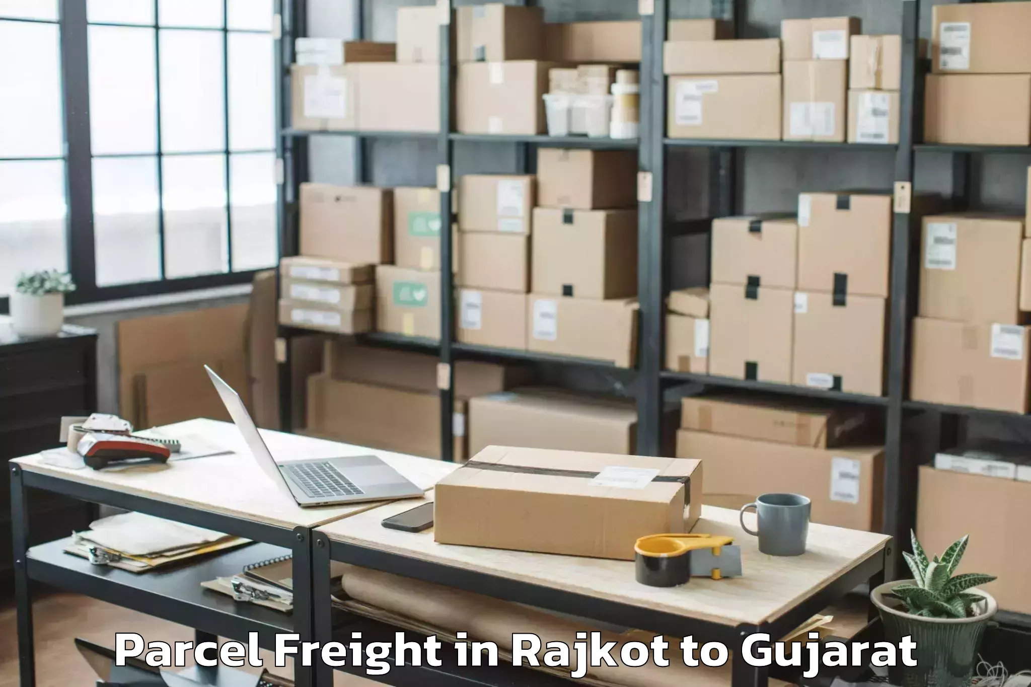 Book Rajkot to Kamrej Parcel Freight Online